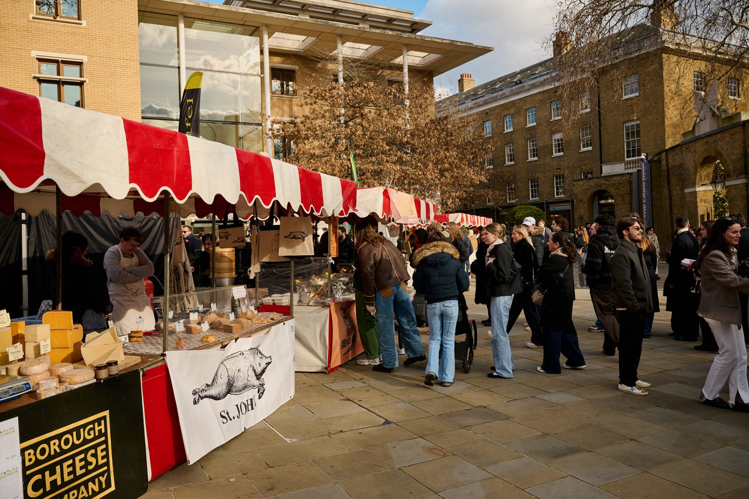 A collection of market stalls with red and white awning in Duke of York Square