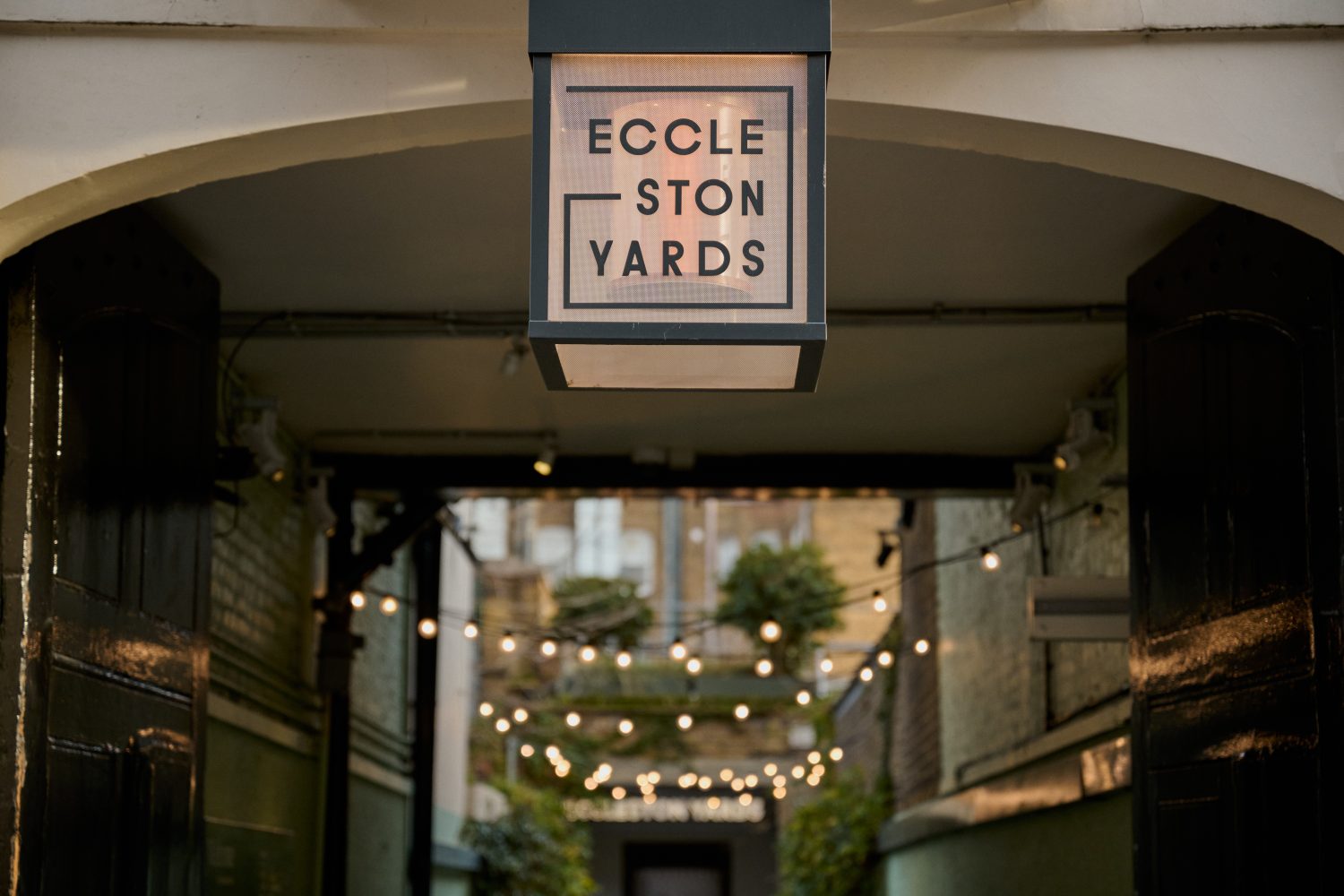 Close up view of a sign on the exterior of a building reading 'Eccleston Yards'