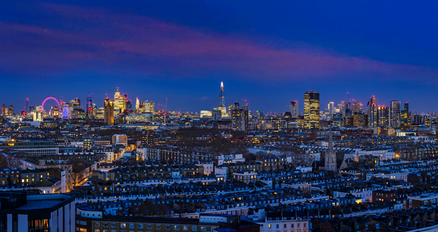 London city skyline at dusk from 16th floor of new apartment at Ebury looking out towards the London Eye, The Shard and Canary Wharf